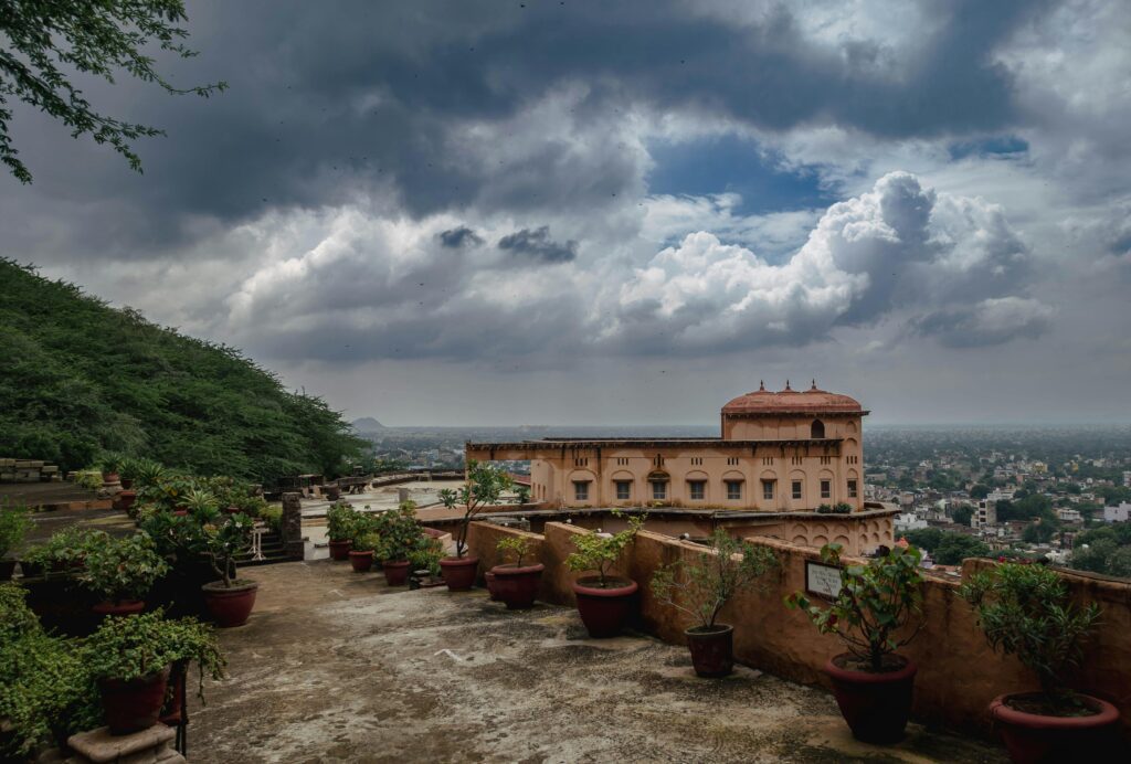View from Lohagarh Fort Bharatpur terrace with historic building and cloudy sky